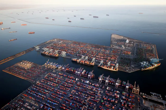 Container ships anchored by the ports of Long Beach and Los Angeles as they wait to offload