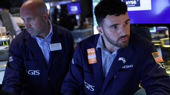 Traders work on the trading floor at the New York Stock Exchange (NYSE) in Manhattan, New York City, U.S., August 8, 2022. REUTERS/Andrew Kelly