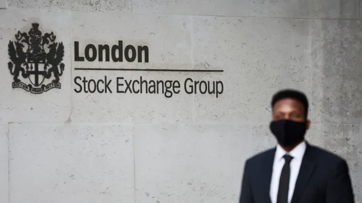 A security guard stands outside the London Stock Exchange building on December 29, 2020.