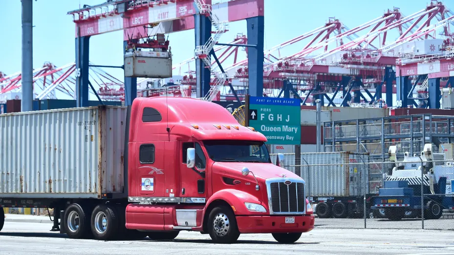 A container delivery truck heads for one of the terminals at the Port of Long Beach in Long Beach, California.