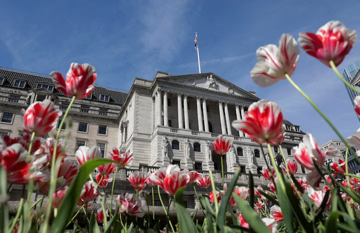 The Bank of England building is seen surrounded by flowers in London