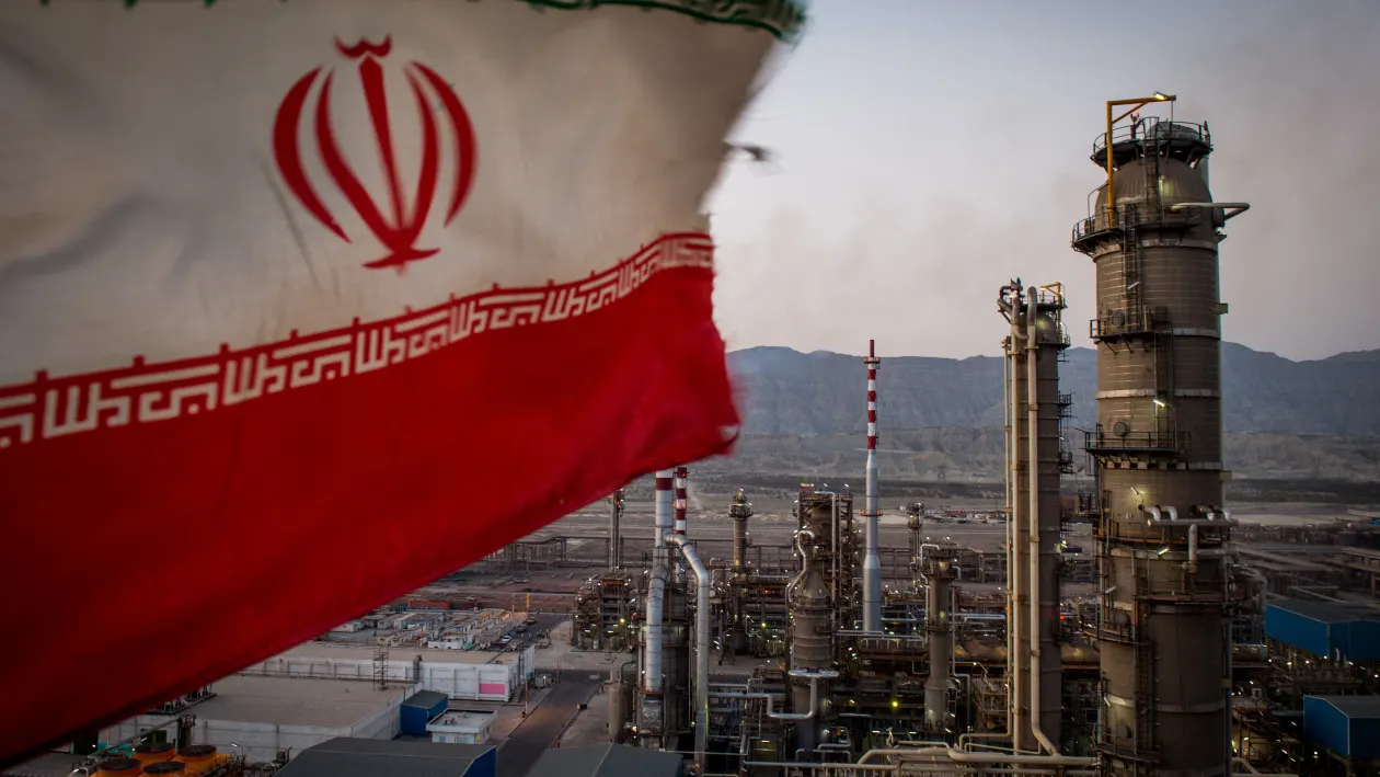 An Iranian national flag flies at the Persian Gulf Star Co. (PGSPC) gas condensate refinery in Bandar Abbas, Iran, on Wednesday, Jan. 9. 2019. The third phase of the refinery begins operations next week and will add 12-15 million liters a day of gasoline output capacity to the plant, Deputy Oil Minister Alireza Sadeghabadi told reporters. Photographer: Ali Mohammadi/Bloomberg via Getty Images